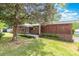 Charming brick home featuring mature landscaping, a welcoming entrance, and a well-maintained lawn at 1102 E 13Th St, Kannapolis, NC 28083