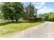 Traditional brick home featuring a large front lawn and a covered portico at 1102 E 13Th St, Kannapolis, NC 28083