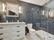 This bathroom features a tiled shower, modern fixtures, toilet and vanity at 1139 Yale Pl, Charlotte, NC 28209