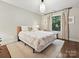Bright bedroom showcasing a large window and comfortable furnishings at 1139 Yale Pl, Charlotte, NC 28209