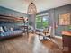 Comfortable bedroom features hardwood floors, bunk beds, accent chair and natural light at 1139 Yale Pl, Charlotte, NC 28209