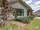 Charming home exterior with brick pathway, lush landscaping, and attractive architectural details at 1139 Yale Pl, Charlotte, NC 28209