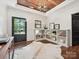 Stylish foyer featuring hardwood floors, custom shelving, unique light fixture, and a view to the exterior at 1139 Yale Pl, Charlotte, NC 28209