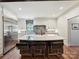 Modern kitchen featuring a large island with seating, stainless steel appliances, and custom cabinetry at 1139 Yale Pl, Charlotte, NC 28209