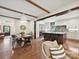 Open layout with a dining area and kitchen view; showcases beamed ceilings and hardwood floors at 1139 Yale Pl, Charlotte, NC 28209