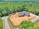 A new home blends modern design and natural serenity, nestled among dense green trees and ample land at 124 Starboard Ln, Statesville, NC 28677