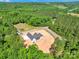 Modern home surrounded by lush trees on a generous lot, offering privacy and a serene setting at 124 Starboard Ln, Statesville, NC 28677