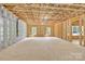 Unfinished basement with visible framework, mechanicals, and natural light through dual windows at 124 Starboard Ln, Statesville, NC 28677