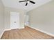 A bedroom includes wood-look flooring, neutral paint, and a spacious closet with double doors at 124 Starboard Ln, Statesville, NC 28677