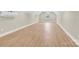 Bright bonus room features wood-look flooring, a modern mini-split air conditioner, and a bright window at 124 Starboard Ln, Statesville, NC 28677