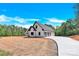 New construction home with a circular driveway and attached three car garage at 124 Starboard Ln, Statesville, NC 28677