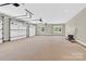 Spacious garage with multiple doors and windows provides ample storage and natural light at 124 Starboard Ln, Statesville, NC 28677