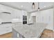 The well-designed kitchen features a functional island, stainless steel appliances, and generous cabinet space at 124 Starboard Ln, Statesville, NC 28677