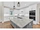 Bright kitchen with stainless steel appliances, granite countertops, and a central island with pendant lighting at 124 Starboard Ln, Statesville, NC 28677