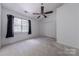 Bedroom with a ceiling fan, window, and a closet at 12749 Mosby Ln, Charlotte, NC 28273