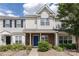 Charming townhome featuring a blue front door, brick facade and manicured landscaping at 12749 Mosby Ln, Charlotte, NC 28273