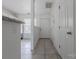 Hallway featuring neutral tile flooring leading to the living spaces at 12749 Mosby Ln, Charlotte, NC 28273
