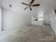 Open living room area with a ceiling fan and a view of the kitchen at 12749 Mosby Ln, Charlotte, NC 28273