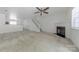 Open living room with fireplace, stairs, and access to the kitchen at 12749 Mosby Ln, Charlotte, NC 28273