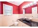 Cozy bathroom with traditional tiled walls, ample lighting, and a black countertop at 1285 10Th Street Nw Blvd, Hickory, NC 28601
