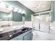 Bathroom with a black vanity, tiled shower, and hexagon tiled floors at 1285 10Th Street Nw Blvd, Hickory, NC 28601