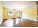 Bright dining room with hardwood floors, natural light, and elegant chandelier at 1285 10Th Street Nw Blvd, Hickory, NC 28601