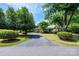 Charming brick home with mature trees and a long driveway leading to the entrance at 1285 10Th Street Nw Blvd, Hickory, NC 28601