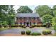 Charming two-story brick home with manicured landscaping and a circular driveway at 1285 10Th Street Nw Blvd, Hickory, NC 28601