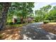 Beautiful two-story brick home with green shutters and a well-manicured front yard at 1285 10Th Street Nw Blvd, Hickory, NC 28601