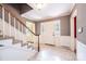 Elegant foyer with a staircase, mosaic tile floor, and white trim at 1285 10Th Street Nw Blvd, Hickory, NC 28601