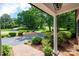 Inviting front yard view from the porch, featuring a well-maintained garden and circular driveway at 1285 10Th Street Nw Blvd, Hickory, NC 28601