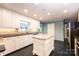 Bright kitchen with white cabinets, a center island, and modern appliances at 1285 10Th Street Nw Blvd, Hickory, NC 28601