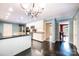 Open-concept kitchen featuring white cabinets, an island, and modern appliances at 1285 10Th Street Nw Blvd, Hickory, NC 28601