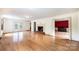 Open-concept living room featuring hardwood flooring, a fireplace, and easy access to the dining room at 1285 10Th Street Nw Blvd, Hickory, NC 28601