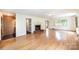 Bright living room featuring a classic fireplace with a brick hearth and hardwood flooring at 1285 10Th Street Nw Blvd, Hickory, NC 28601