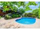 Backyard pool and patio area with a view of the screened porch and lush landscaping at 1285 10Th Street Nw Blvd, Hickory, NC 28601