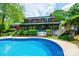 Backyard pool and patio area with view of the home's rear exterior and screened porch at 1285 10Th Street Nw Blvd, Hickory, NC 28601