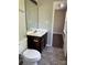 Bathroom features a dark wood vanity and a tiled floor at 1300 Braveheart Ln, Charlotte, NC 28216
