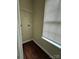 A compact laundry room with shelving and a window offers functionality at 1300 Braveheart Ln, Charlotte, NC 28216