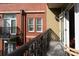 Balcony view showcasing brick architectural details and an open door leading to the interior at 1320 Fillmore Ave # 426, Charlotte, NC 28203