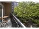 Charming balcony with seating area overlooking lush greenery and the building's courtyard at 1320 Fillmore Ave # 426, Charlotte, NC 28203