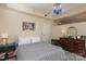 Relaxing bedroom with striped bedding, a blue chandelier, and a dresser with ornate details at 1320 Fillmore Ave # 426, Charlotte, NC 28203