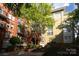 Beautiful courtyard with lush landscaping and a mix of tan and brick building exteriors at 1320 Fillmore Ave # 426, Charlotte, NC 28203