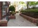 Beautiful courtyard with manicured greenery, walking paths and outdoor seating areas at 1320 Fillmore Ave # 426, Charlotte, NC 28203