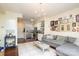 Open concept living space with hardwood floors, a neutral color palette, and access to the kitchen at 1320 Fillmore Ave # 426, Charlotte, NC 28203