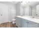 Bathroom with double vanity sink, wood-look flooring, shower, tub and toilet at 13816 Riding Hill Ave, Charlotte, NC 28213