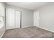 A spacious bedroom with gray walls, sliding door closet, and neutral-toned carpet at 13816 Riding Hill Ave, Charlotte, NC 28213