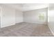 Large bedroom featuring plush carpet, bright windows and neutral paint at 13816 Riding Hill Ave, Charlotte, NC 28213