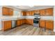 Well-equipped kitchen featuring granite countertops, stainless steel appliances, and ample cabinets at 13816 Riding Hill Ave, Charlotte, NC 28213