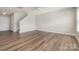 Spacious living room with modern flooring and neutral paint, filled with natural light at 13816 Riding Hill Ave, Charlotte, NC 28213
